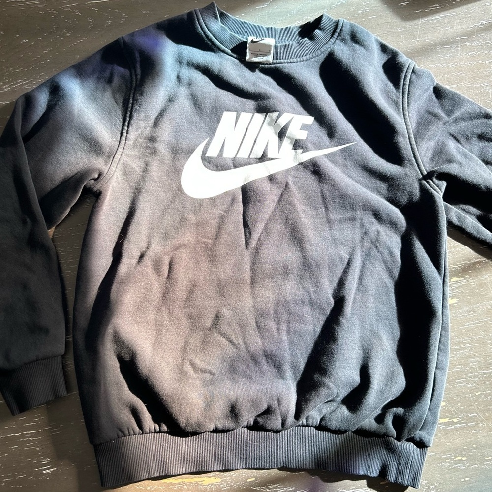 Kids size Large crewneck Nike sweatshirt.  Color is black.